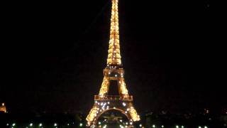 The Eiffel tower lights up