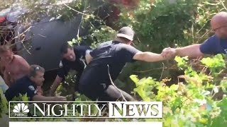 Caught On Camera: Human Chain Rescues Man From Burning Car | NBC Nightly News