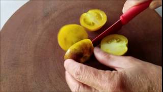 A Hawaiian Woolly Kate Tomato Being Cut