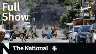 CBC News: The National | West Bank operation, Quebec landslide, Million-dollar Magic card