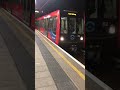 dlr arriving at poplar station for tower gateway dlr docklands poplar london