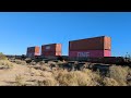 under a high moon union pacific 2697 leads 210 cars west at dateland arizona december 10th 2024