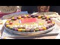 Xinjiang Residents Make Super Large Mooncake to Celebrate Mid-autumn Festival