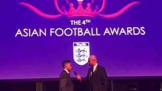 Zidan Miah talking to Sky Sports presenter Dharmesh Sheth at the Asian Football Awards 2017