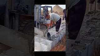 The process of making cement pillars.