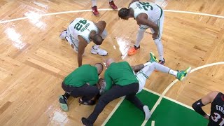 Jayson Tatum goes down with an apparent shoulder injury