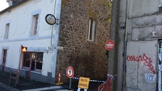 Le mur d'une maison s'effondre