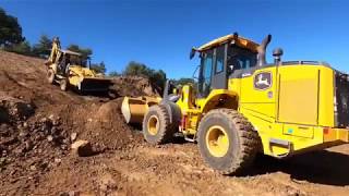 moving dirt with a brand new 624l Deere loader