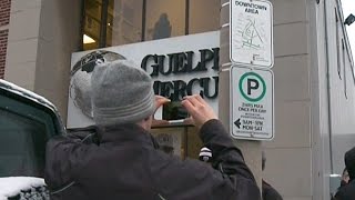 Dozens say goodbye to the Guelph Mercury by hugging building