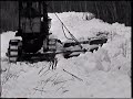 Plowing snow with a TD 6 dozer with wing