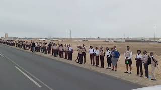 #watch Learners and community members are lined up along the road from the airport to Dunes Mall