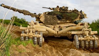 M1A2 Abrams tanks and infantry fighting vehicles at a training ground in Poland, NATO.