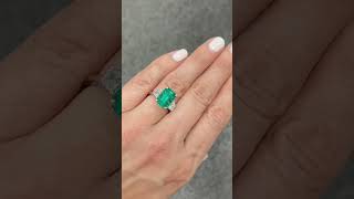 4.70-carat green emerald trilogy with 1-carat trapezoid cut on each side