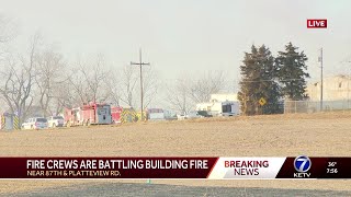 Fire crews battling flames at a building in Sarpy County