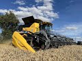 New Holland in the fields cutting Wheat and Peas. Tipping out the seeds and tyre repairs | farming