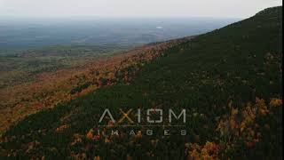 6K aerial video flying over colorful forest, Mount Kearsarge, autumn, Wilmot, New Hamp.. | AX151_112