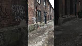 Laneway beside abandoned factory toronto january 24, 2023 day before major snow storm