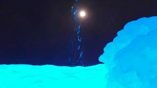 Full moon seen from ice geyser