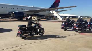 Police escort leads Patriots motorcade into Houston from airport