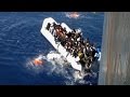 Migrants Flee Sinking Dinghy in Dramatic Footage