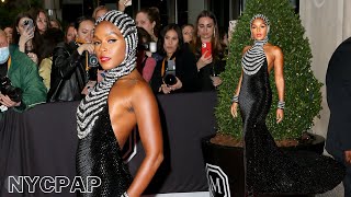 Janelle Monáe poses for photographers before heading to the Met Gala