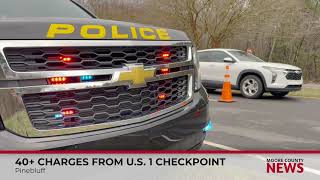 Pinebluff checkpoint leads to 2 arrests, over 40 charges