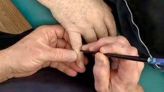 Deep hand massage using tools like chopsticks and acupressure pen to release a tight elbow.