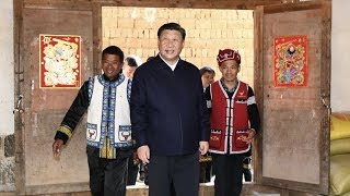 Xi Jinping makes traditional rice snacks with Wa ethnic people