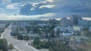 Pyrocumulonimbus clouds (from forest fires) forming behind the city of Yellowknife.