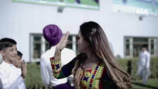 Diva Patang playing cricket with children during Shpageeza