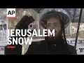 Residents in Jerusalem get rare chance to play in snow