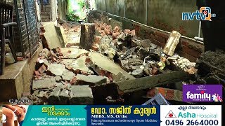 തിമിര്‍ത്ത് പെയ്യുന്ന മഴയില്‍ വടകര മത്സ്യമാര്‍ക്കറ്റ് പരിസരത്തെ മതിലിടിഞ്ഞു