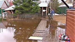 Талая вода пришла в огороды сургутян