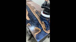 Buffing in Odie's oil on Midnight blue epoxy table