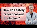 How do I safely reheat cooked chicken?