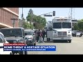 Hostages released, suspect dead after standoff at Chase bank building in Bakersfield