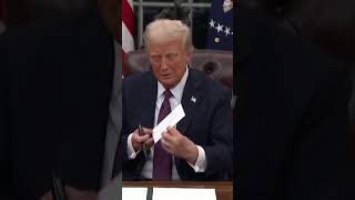 Donald Trump shows reporters Joe Biden’s letter | REUTERS