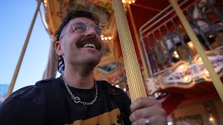 pov: a grown man rides the carousel in SF