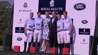 Harry gets a kiss from Model Karolina Kurkova after winning the Sentebale Royal Salute Polo Cup