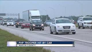 FHP trooper hit by car while working crash on I-95 in Martin County