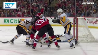 Nico Hischier scores a goal against the Pittsburgh Penguins