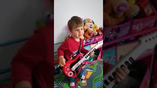 Eric plays Toy Guitar Music Challenge #shorts