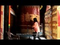 golden buddha statue inside the tibetan buddhist monastery