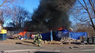 Large fire in Minneapolis at apparent encampment under control