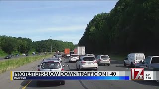 Protesters slow down traffic on I-40 in Raleigh