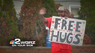 Years after the first embrace, a Williamsville man's free hugs have become a hot commodity