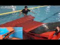 動画1 遮水ゴムシート張りのため池に滑落する水難事故の実験の様子　simulation of a water accident that slides down into a pond