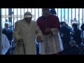 Pope Emeritus Benedict XVI walks through the Holy Door