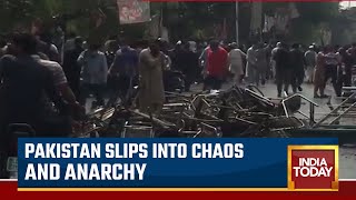 Imran Khan's Supporters And Police Engage In Violent Clashes Over Attempts To Arrest Former Pak PM