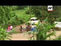 Ambulances head towards Thai cave as rain falls